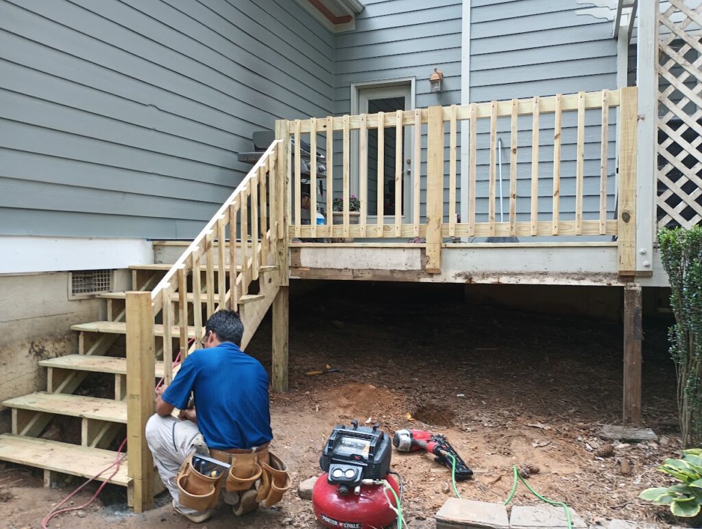 Deck remodel with the stairs and railing completed.
