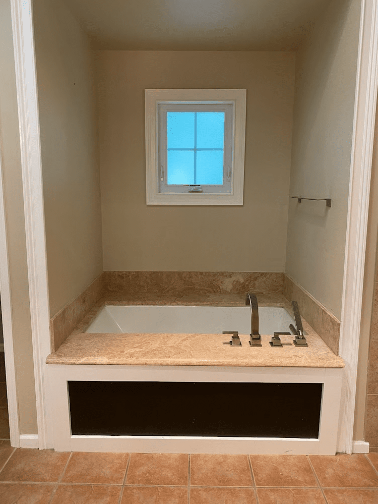 Master bathroom built in bathtub before remodel. 