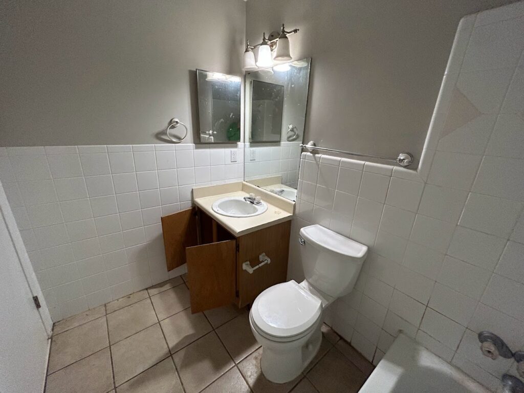 Guest bathroom before condominium remodel.